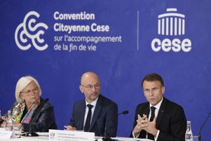 PRINT
France's President Emmanuel Macron, next to CESE's president Thierry Beaudet (C) and France's Minister for Labour, Health and Solidarities Catherine Vautrin (L), delivers a speech at the final seminar of the End-of-Life Convention at the Economic, Social and Environmental Council (CESE) in Paris on April 26, 2024. (Photo by Ludovic MARIN / POOL / AFP)